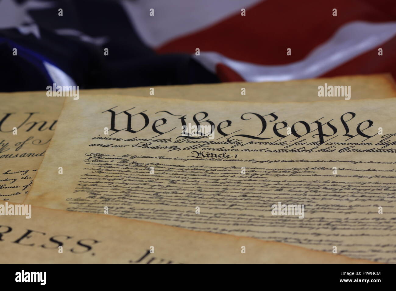 Historical Document US Constitution - We The People with American Flag Stock Photo