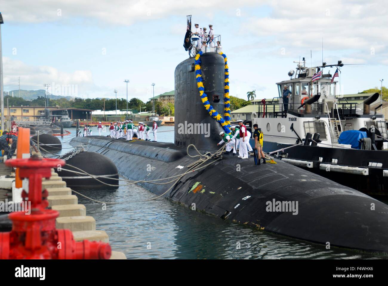 US Navy Virginia-class attack submarine USS Hawaii with a giant floral lei on the conning tower returns to Joint Base Pearl Harbor-Hickam for routine operations March 10, 2015 in Honolulu, Hawaii. Stock Photo