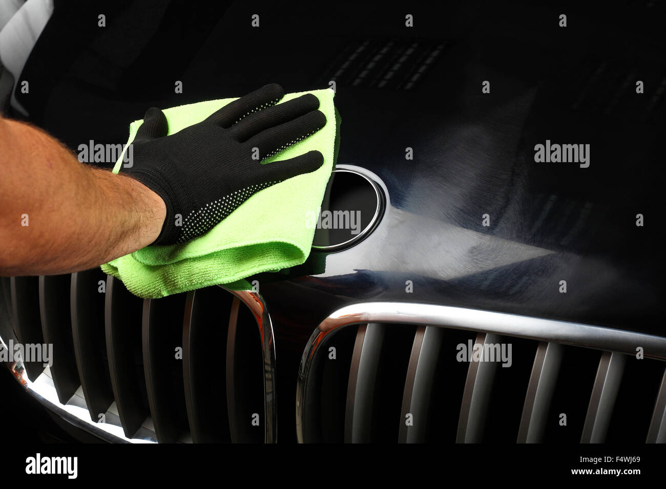 The worker polishes the car with special rag. Close up Stock Photo - Alamy