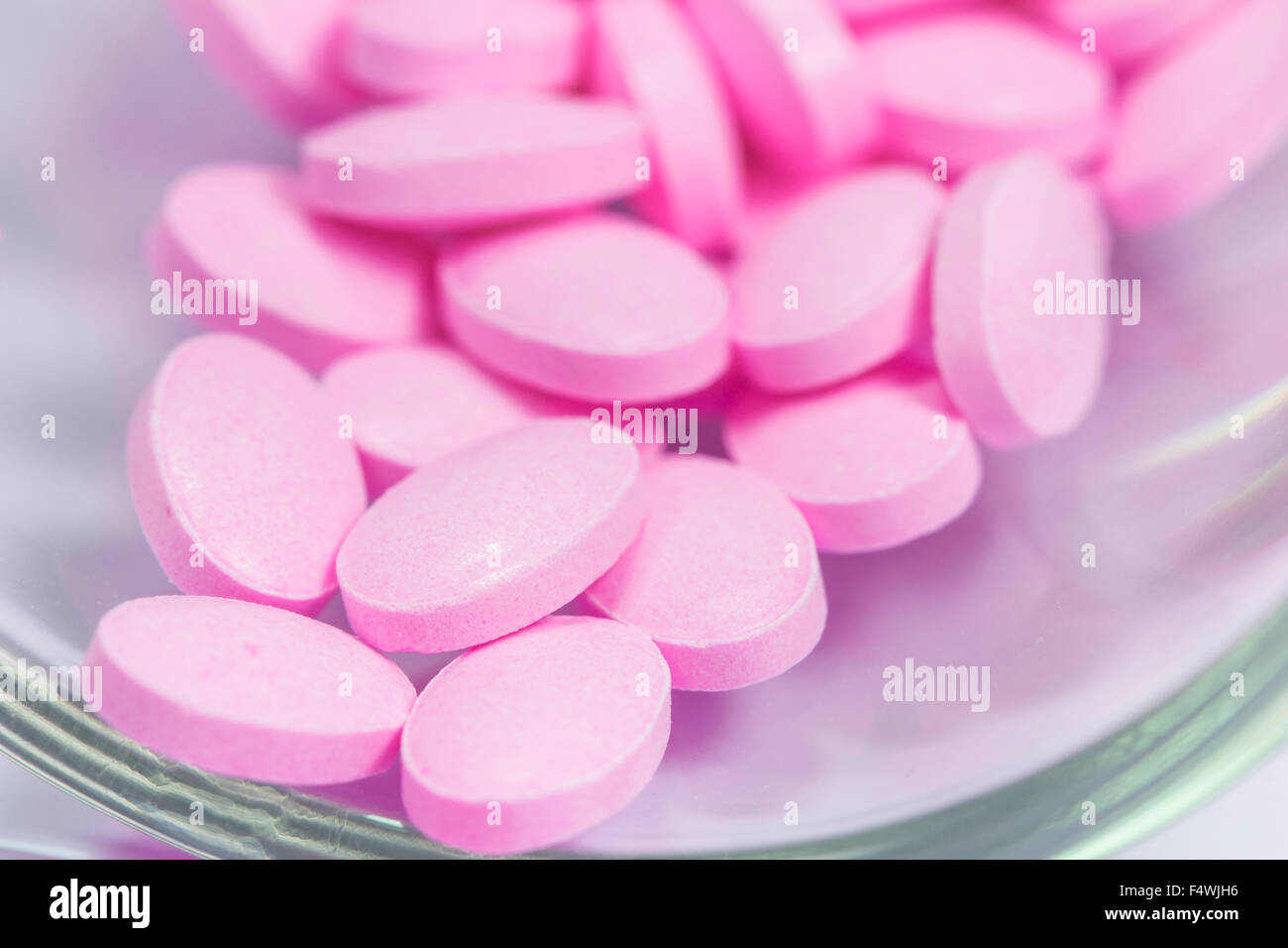 The pink tablets isolated on white background stock photo alamy
