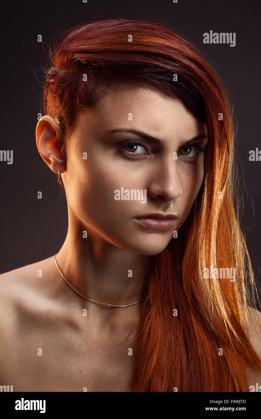 portrait of a beautiful girl with red hair in studio Stock Photo - Alamy