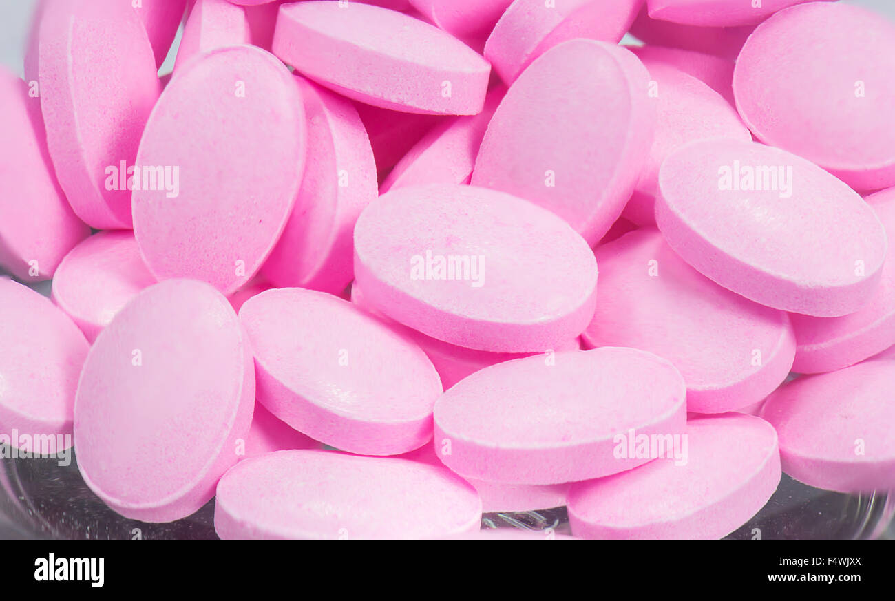 The pink tablets isolated on white background Stock Photo Alamy