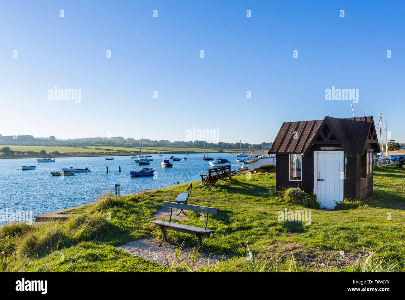 The Ferry Hut and boats moored at the mouth of the River Aln, Alnmouth, Northumberland, England, UK Stock Photo