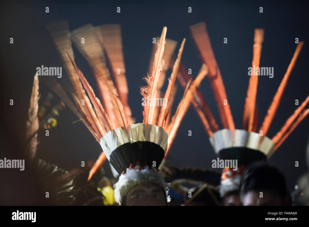 Palmas, Brazil. 22nd Oct, 2015. Indigenous warriors dance with their feather headdresses at the Fire ceremon to open the first ever International Indigenous Games, in the city of Palmas, Tocantins State, Brazil. Credit:  Sue Cunningham Photographic/Alamy Live News Stock Photo