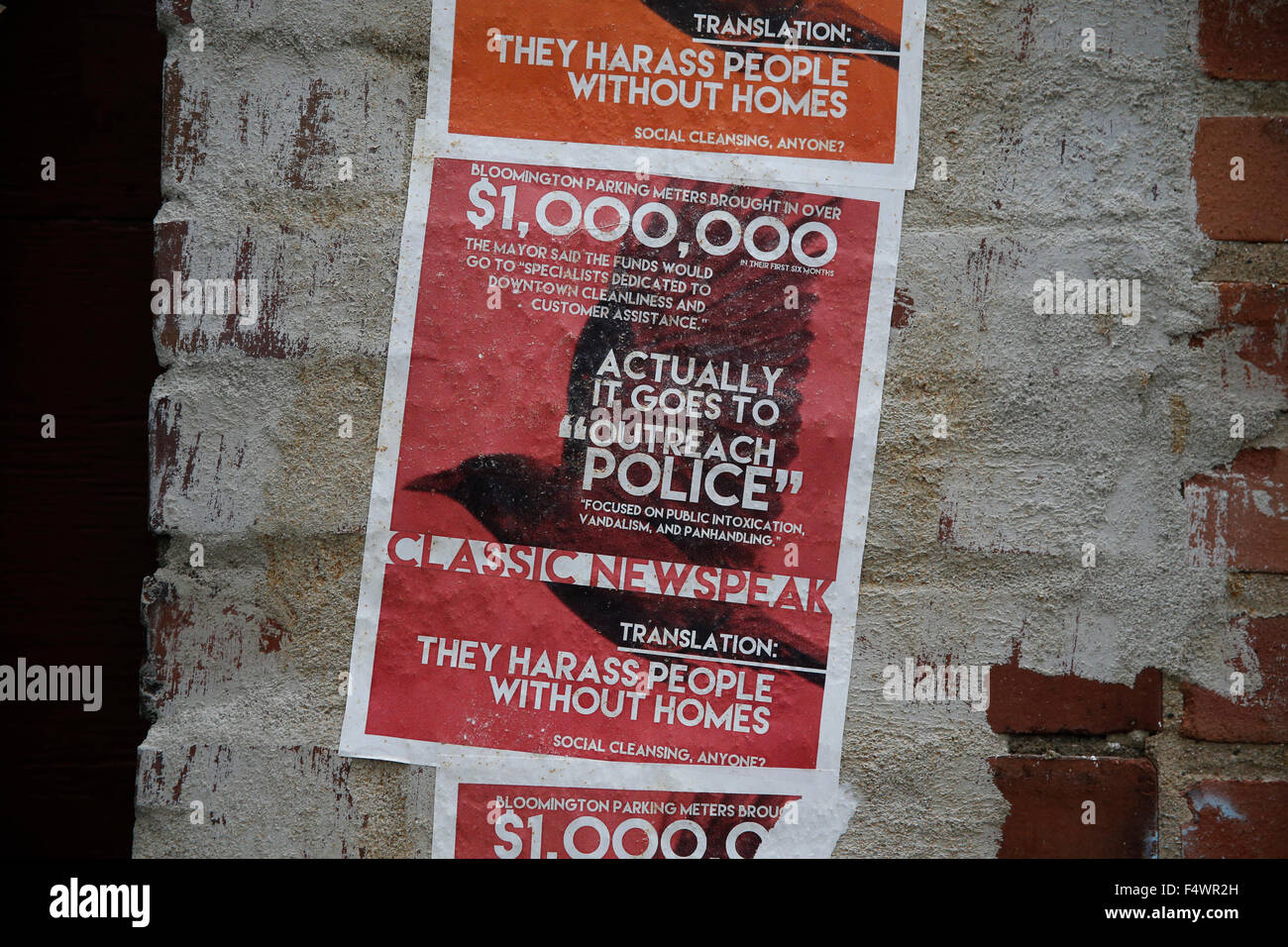 anti-police poster in alley put there by anarchist activists makes a reference to newspeak in the novel 1984. activists were upset the police have officers dedicated to dealing with the homeless population. the police officers are called outreach police Stock Photo