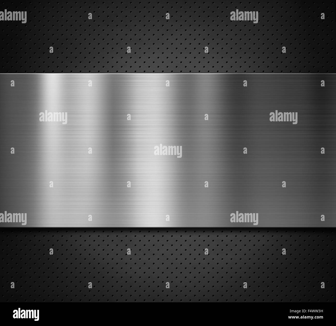 metal plate over black perforated background Stock Photo