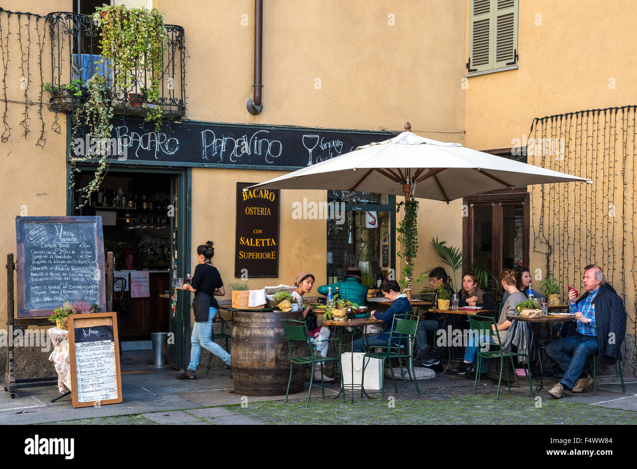 Outdoor restaurant with people seated at tables, Turin, Piedmont, Italy Stock Photo