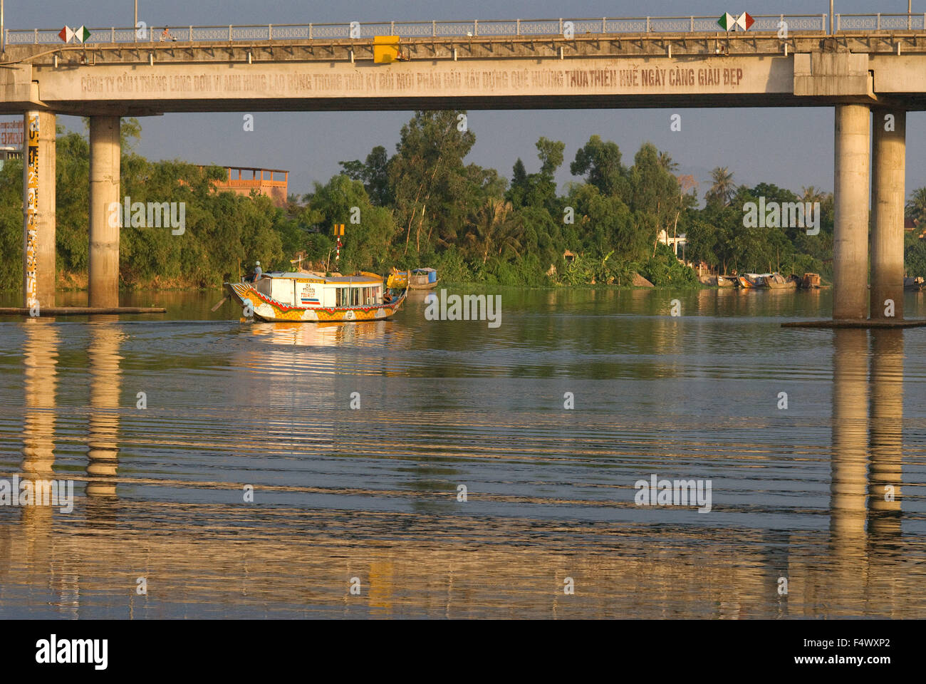 Dragon boat cuise on the river Huong (Perfume River). Vietnam. Dragon head and excursion boat, Song Huong or Huong Giang or Perfume River, near Hue, North Vietnam, Vietnam, Southeast Asia. Stock Photo