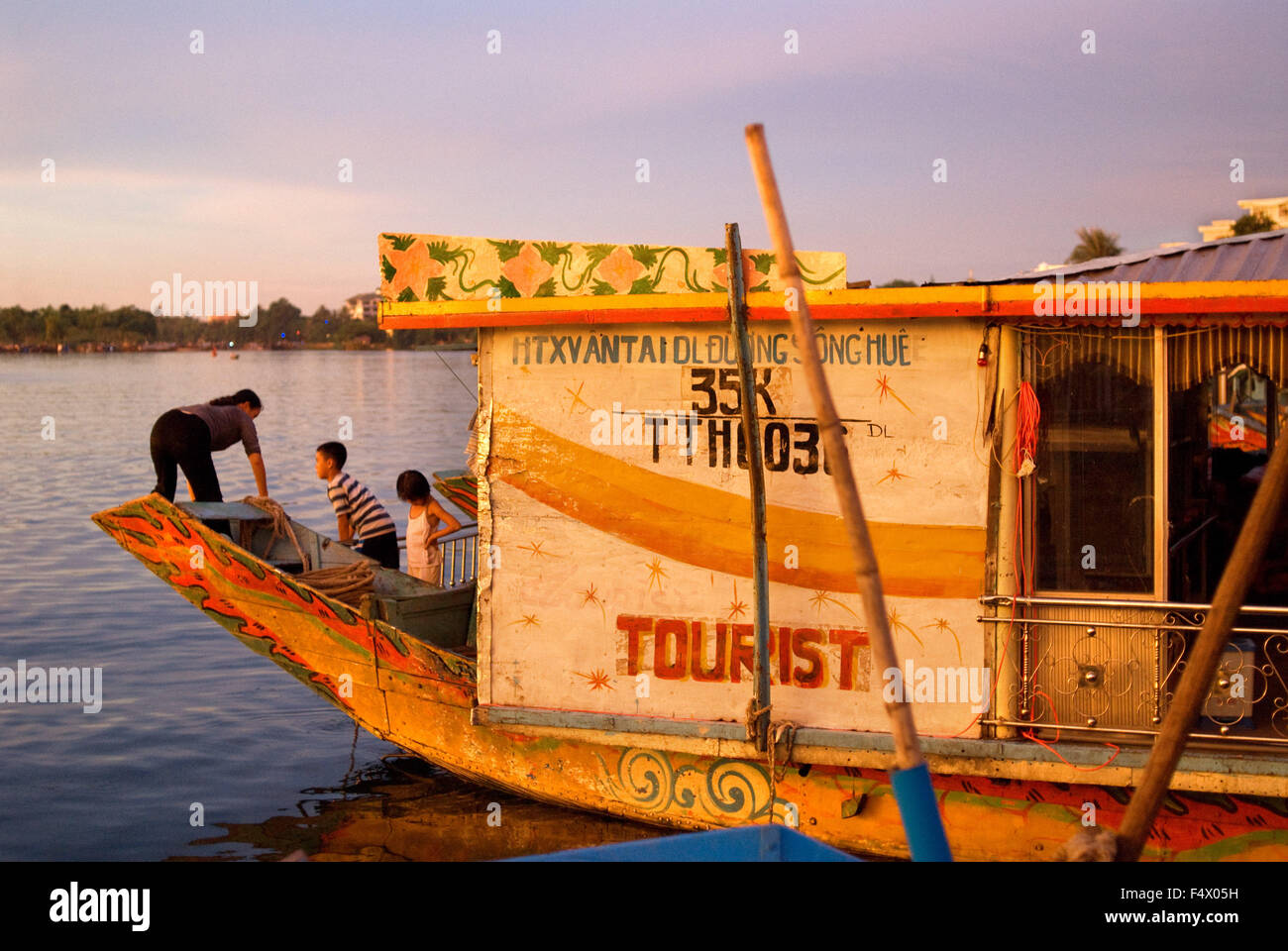 Dragon boat cuise on the river Huong (Perfume River). Vietnam. Dragon head and excursion boat, Song Huong or Huong Giang or Perfume River, near Hue, North Vietnam, Vietnam, Southeast Asia. Stock Photo