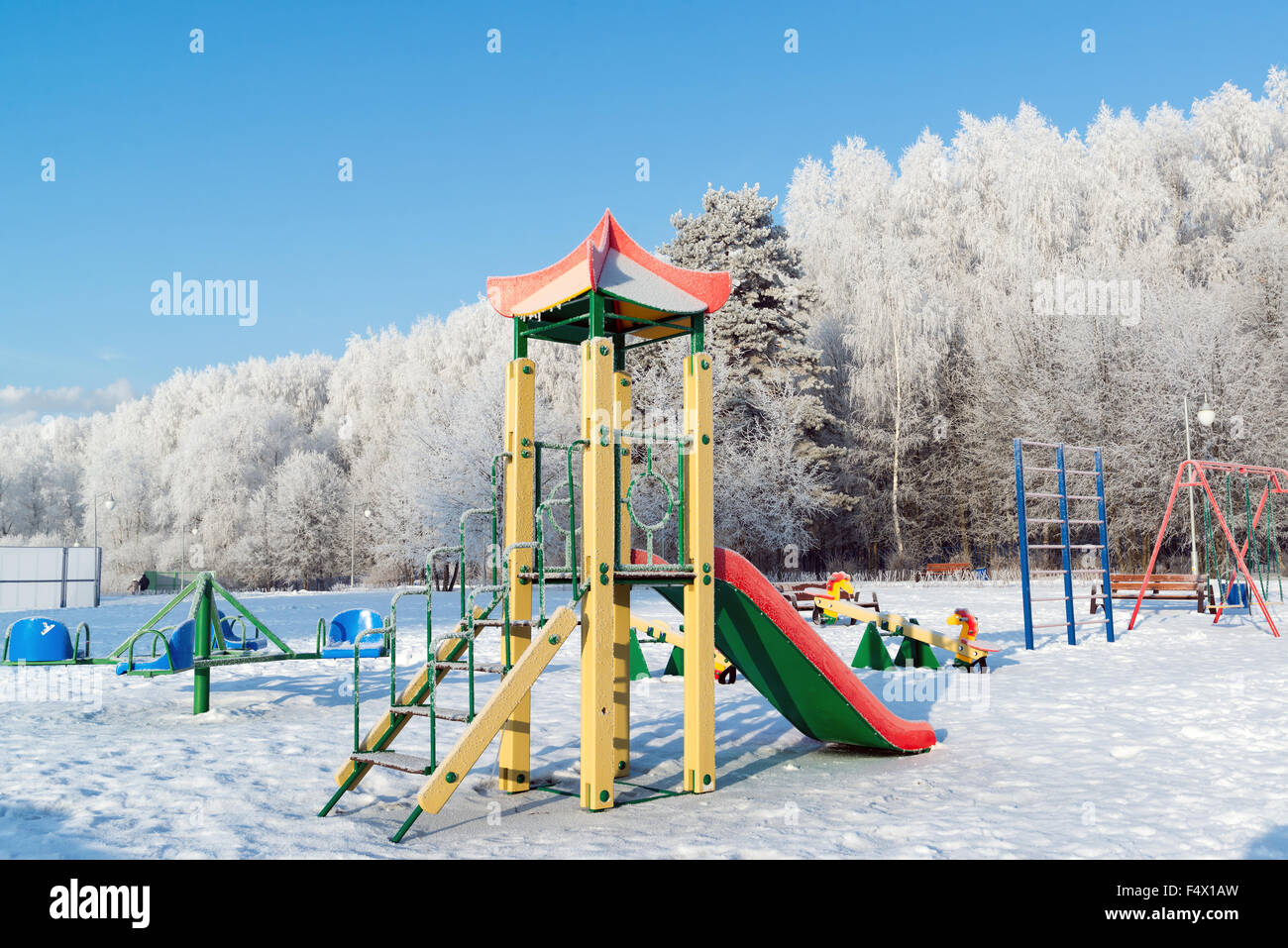 Playground structure outdoors in winter Stock Photo - Alamy