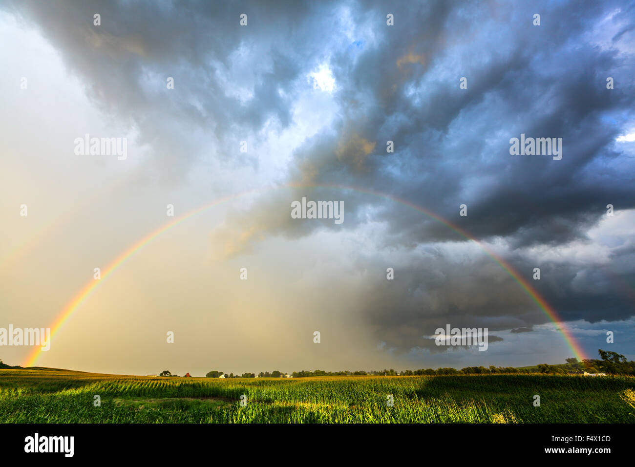 A rainbow follows a thunderstorm in Mohawk Valley. New York State, USA Stock Photo