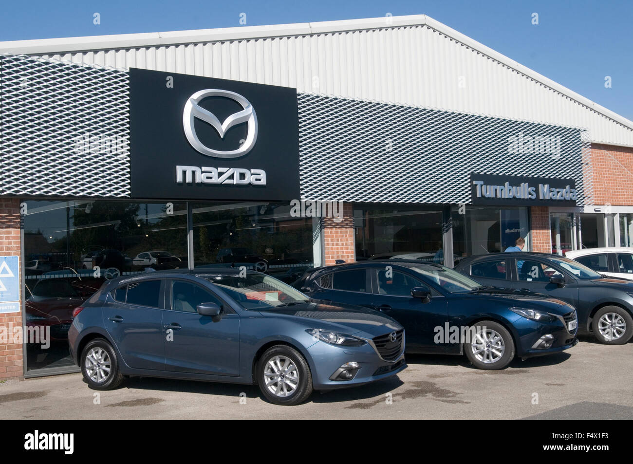 mazda dealership garage dealership dealerships franchised car cars Japanese manufacturer manufacturers maker Stock Photo