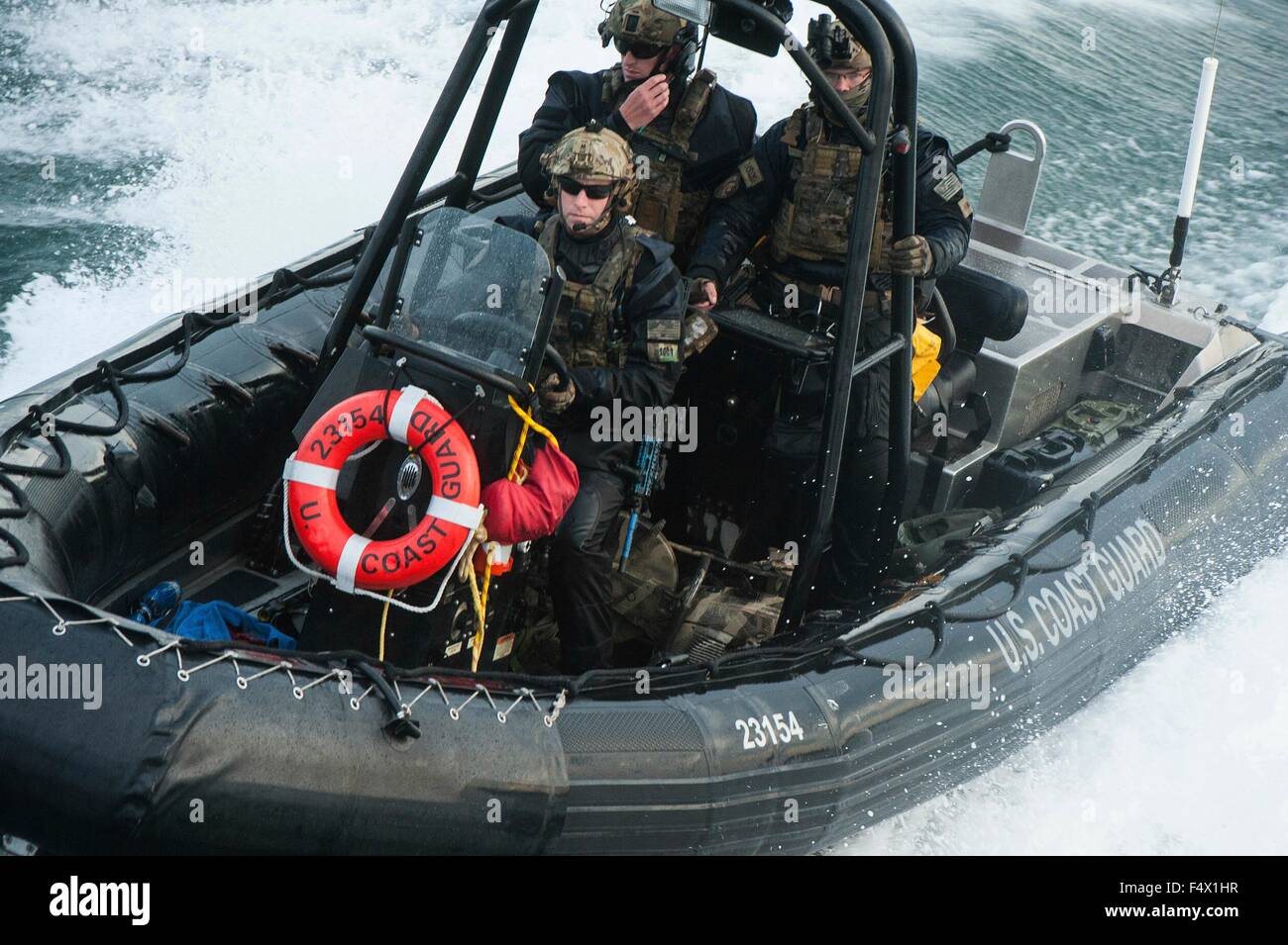 Commandos with the U.S. Coast Guard's Maritime Security Response Team ready assault force during a tactical boardings-at-sea exercise October 22, 2015 in Hyannis, Massachusetts. Stock Photo
