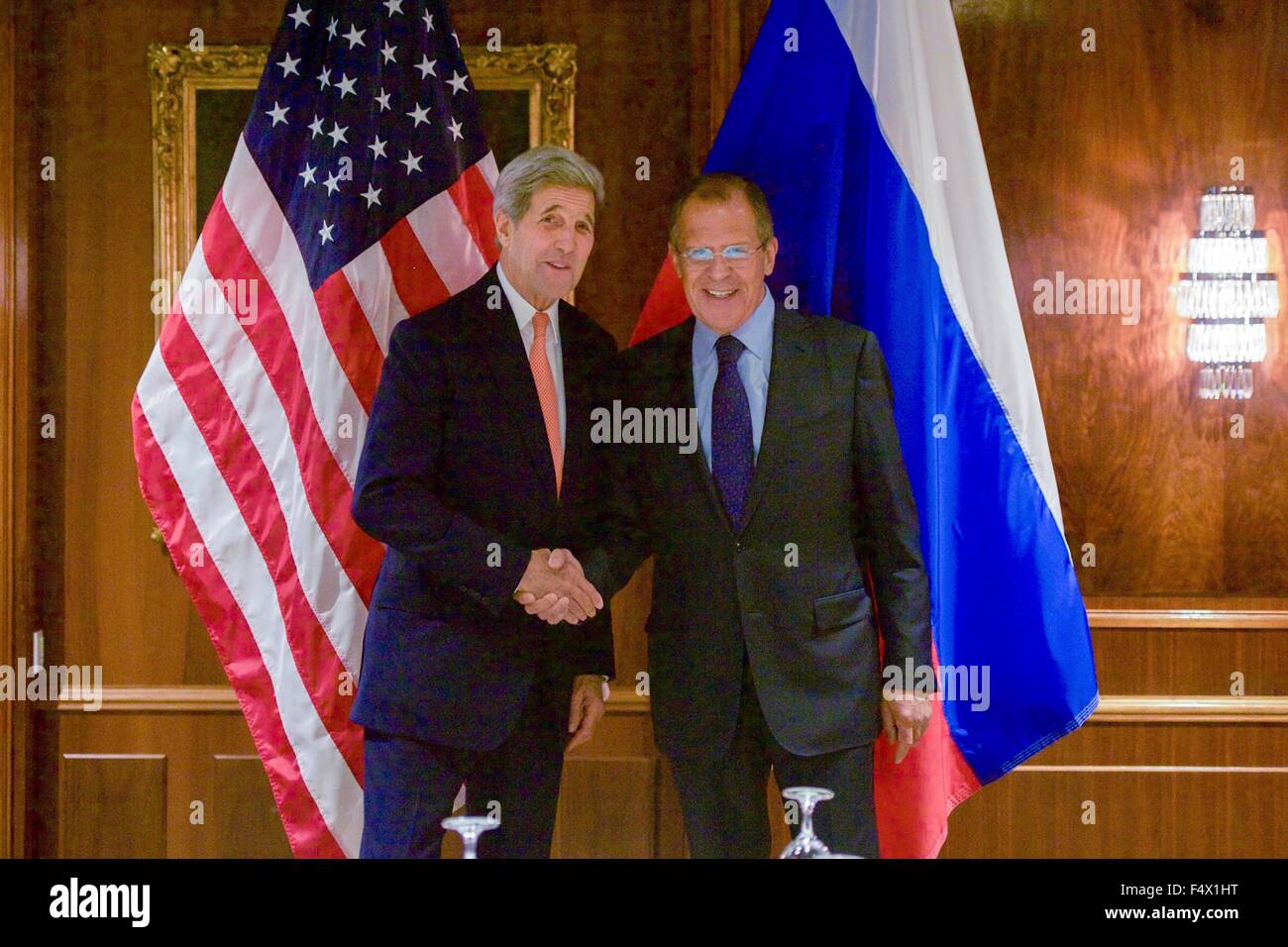 Vienna, Austria. 23rd Oct, 2015. US Secretary of State John Kerry shakes hands with Foreign Minister Sergey Lavrov before a bilateral meeting focused on Syria at the Imperial Hotel October 23, 2015 in Vienna, Austria. Stock Photo