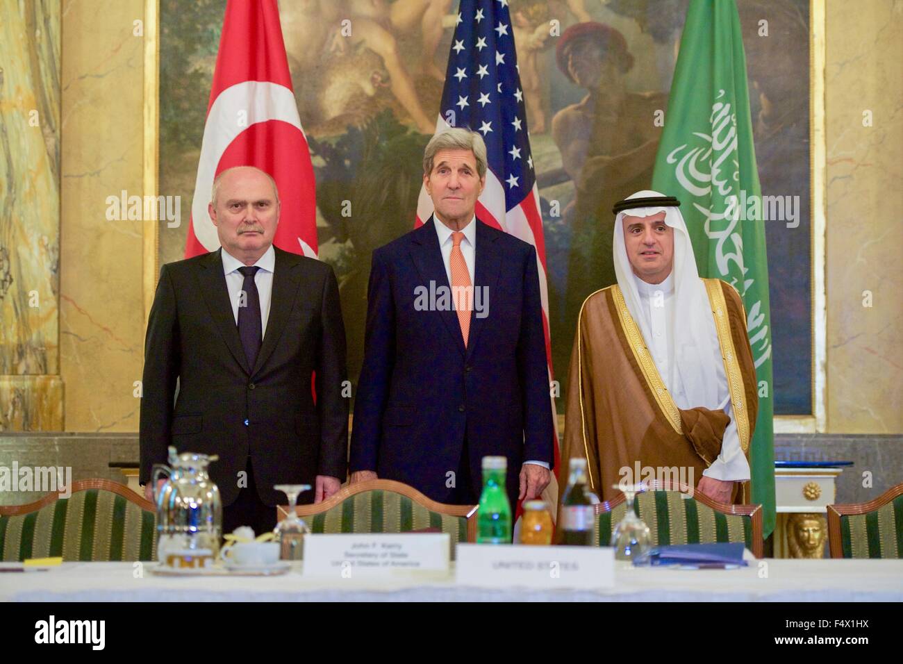 Vienna, Austria. 23rd Oct, 2015. US Secretary of State John Kerry stands with Turkish Foreign Minister Feridun Sinirloglu and Saudi Foreign Minister Adel al-Jubeir before a three-way meeting focused on Syria at the Imperial Hotel October 23, 2015 in Vienna, Austria. Credit:  Planetpix/Alamy Live News Stock Photo