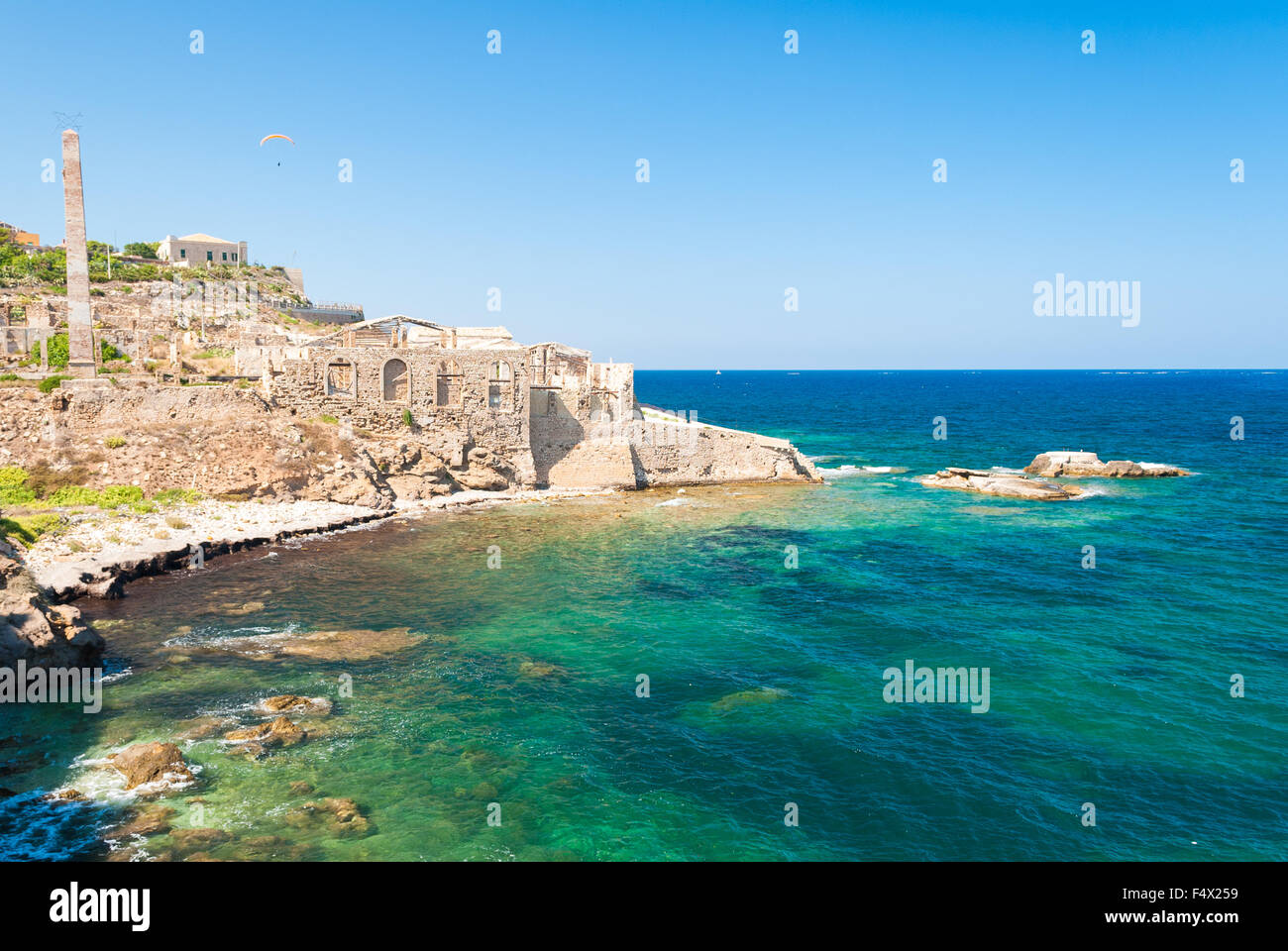 Coastline of Portopalo, in southern Sicily, with the ruins of an old ...