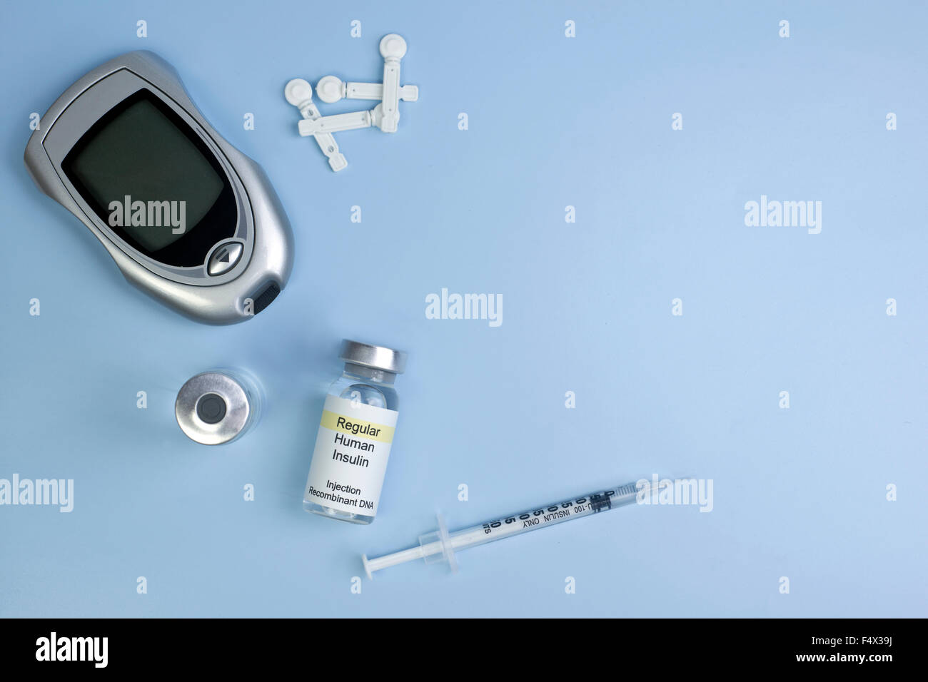 Diabetes supplies background on light blue with copyspace. Stock Photo