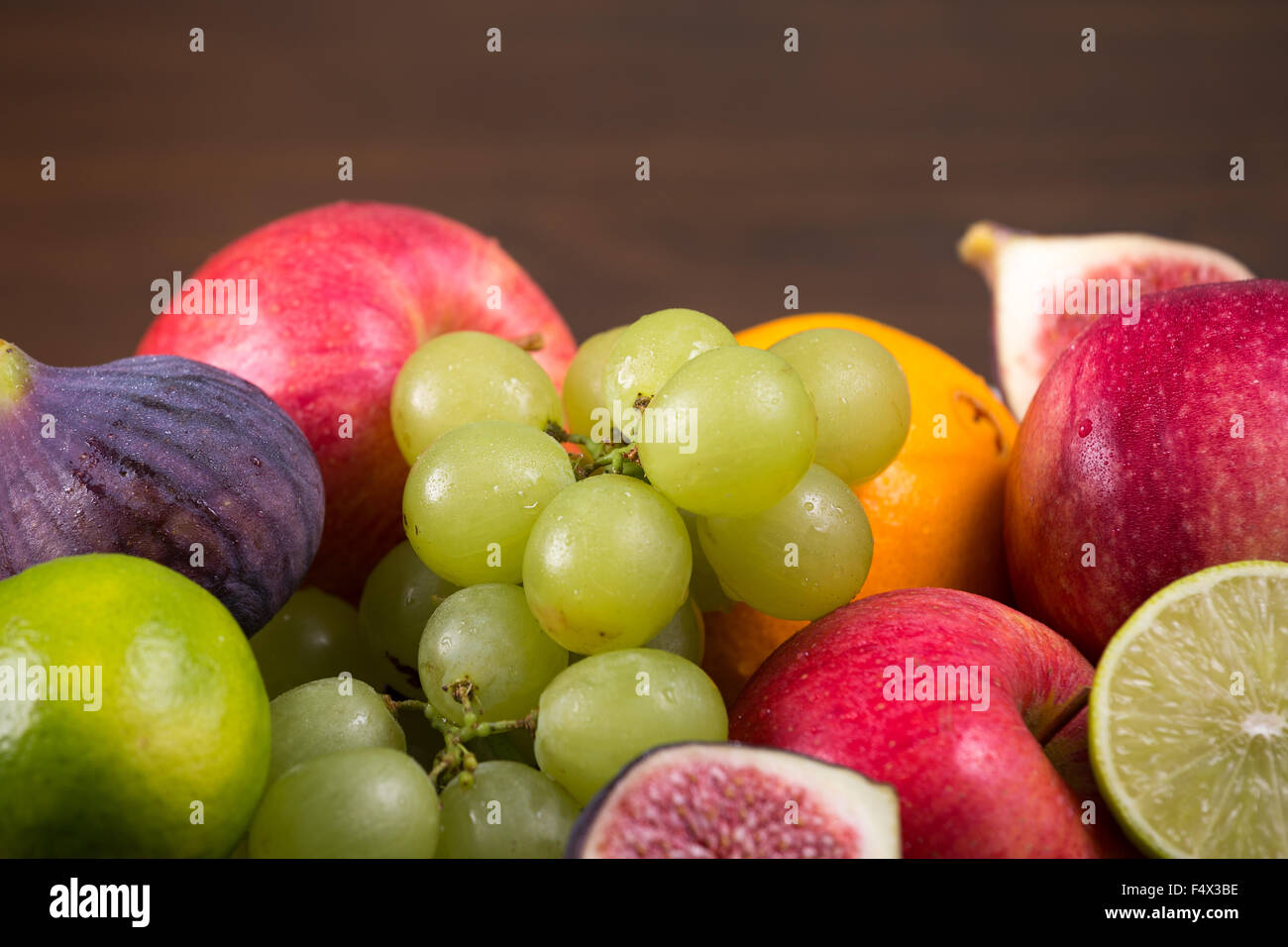 Assortment fruits on wooden table Stock Photo - Alamy