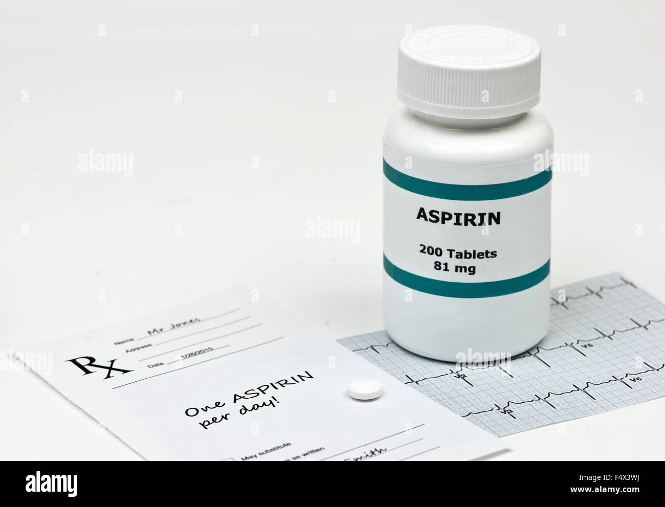 Daily aspirin tablet with bottle, prescription, and electrocardiograph Stock Photo Alamy