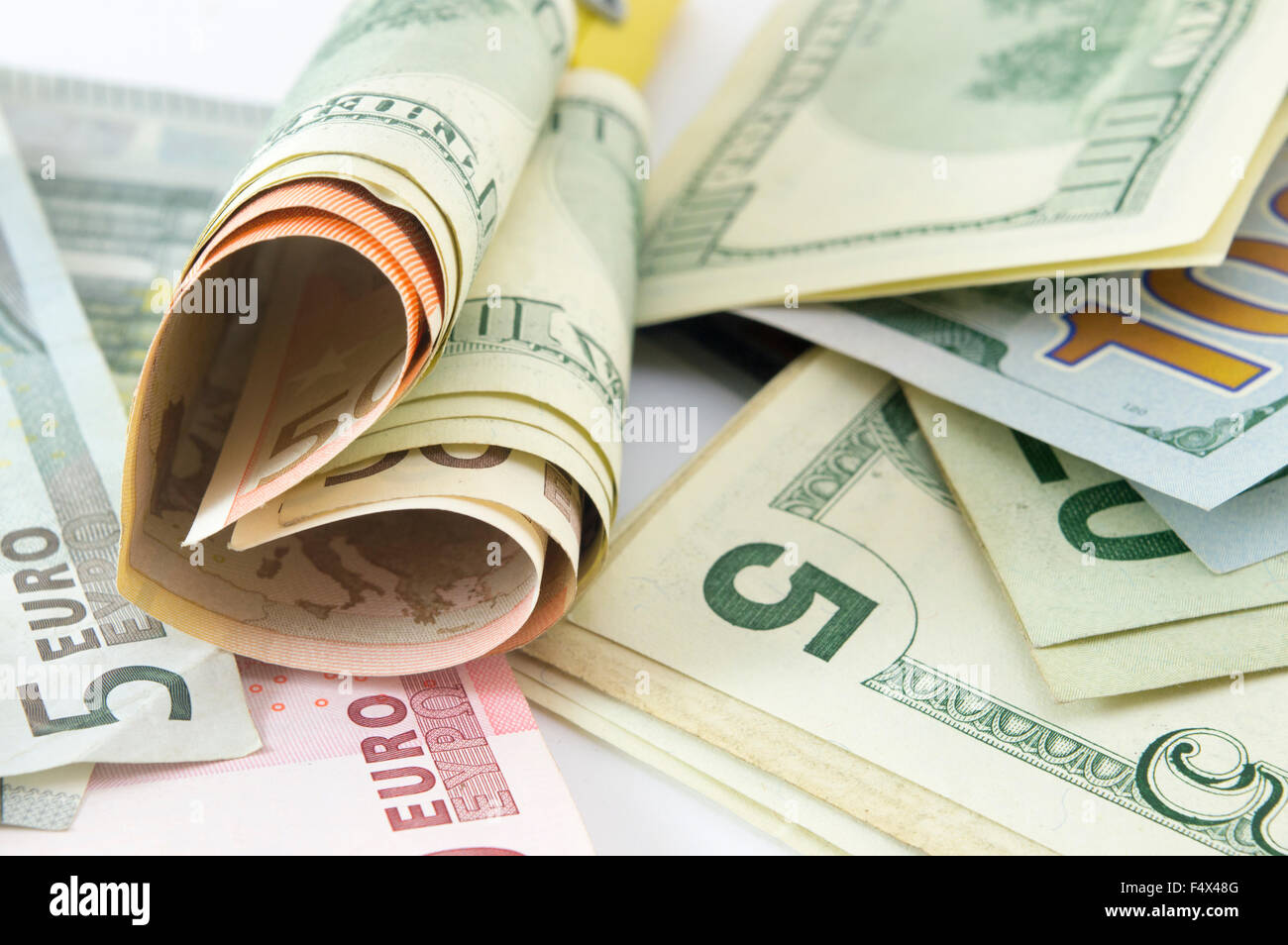 Bunch of dollar bills on the table forming a heart shape Stock Photo