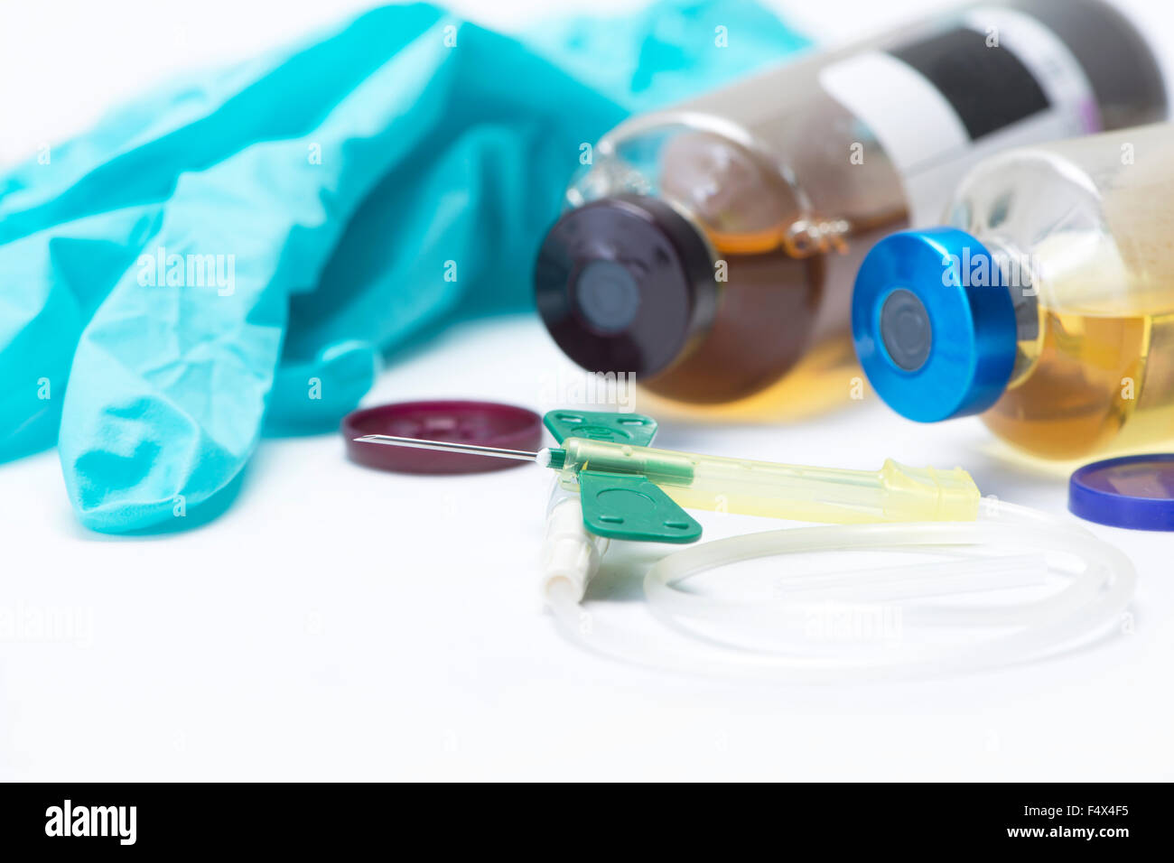 Green safety catheter with aerobic and anaerobic blood culture bottles. Stock Photo