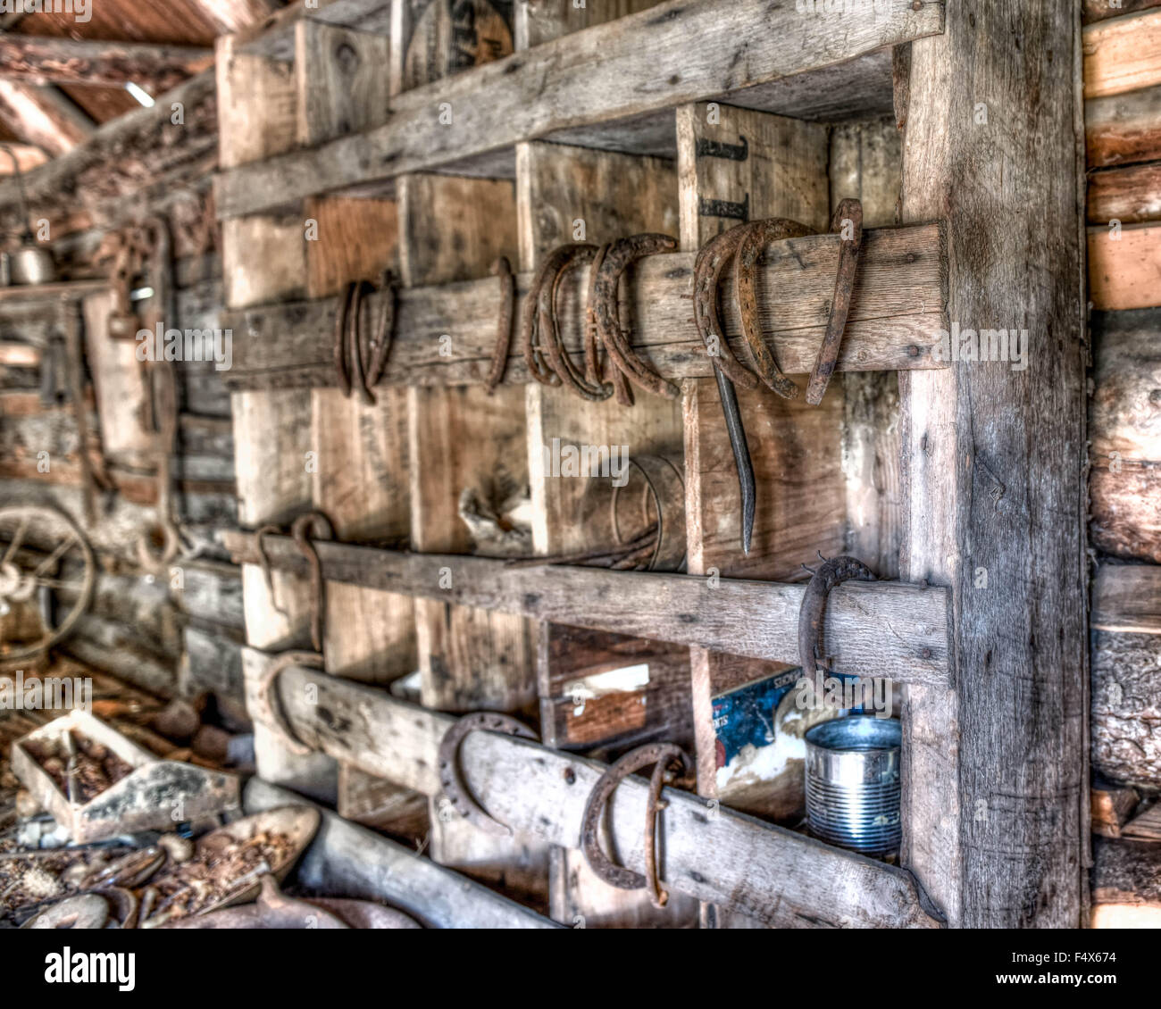 Rusty horseshoes are hung in an old barn in Alaska Stock Photo Alamy