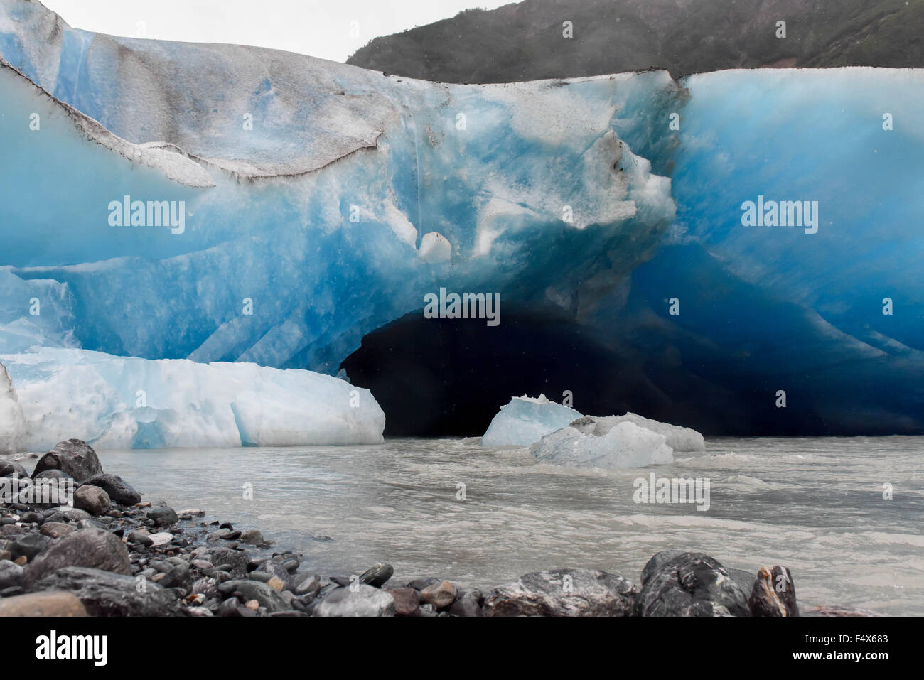 Entry way to a blue ice cave on an Alaskan cruise excursion hike to Davidson glacier near Skagway Alaska | Inside passage - Lynn Canal - Haines AK Stock Photo