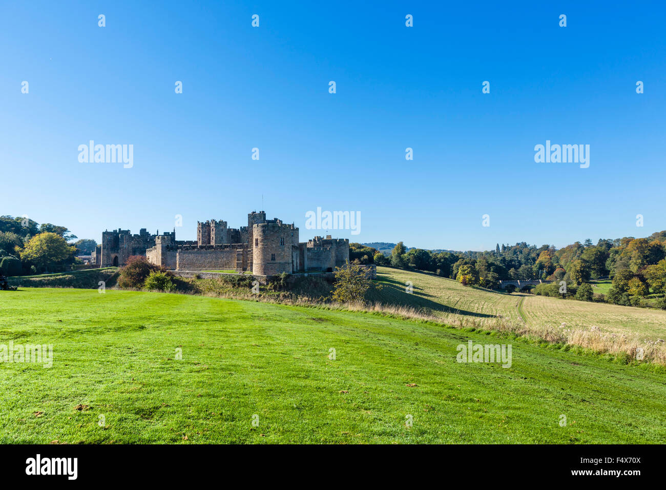 Alnwick Castle in autumn sunshine, Alnwick, Northumberland, England, UK Stock Photo