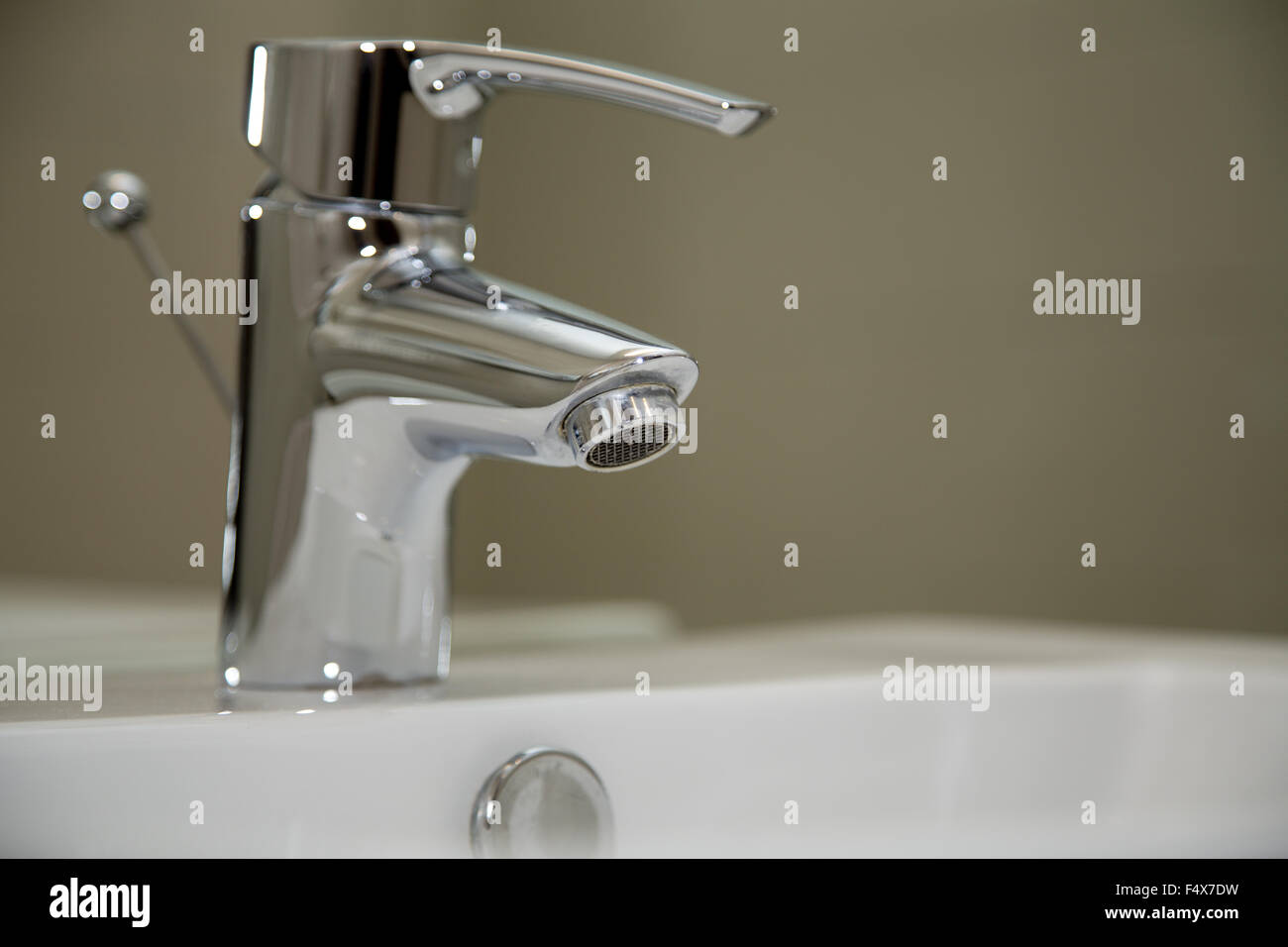 Close Up of water crane in bathroom Stock Photo