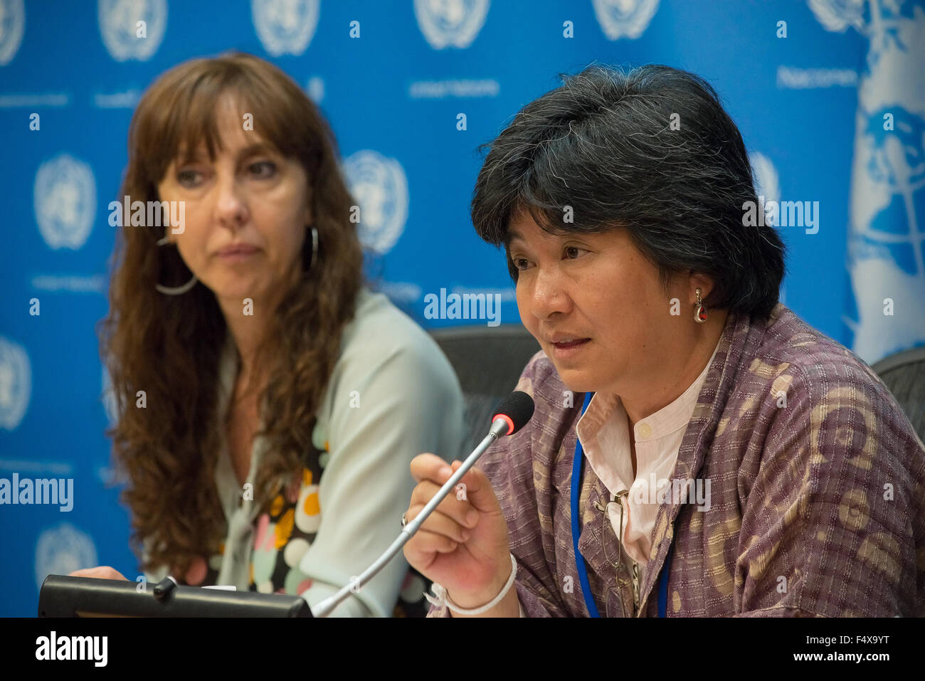 New York, United States. 23rd Oct, 2015. Joan Carling (right) speaks to the press. A panel of experts held a press conference at the United Nations, calling attention to how the recently adopted Sustainable Development Goals framework must take account matters of concern to the world's indigenous people. Credit:  Albin Lohr-Jones/Pacific Press/Alamy Live News Stock Photo