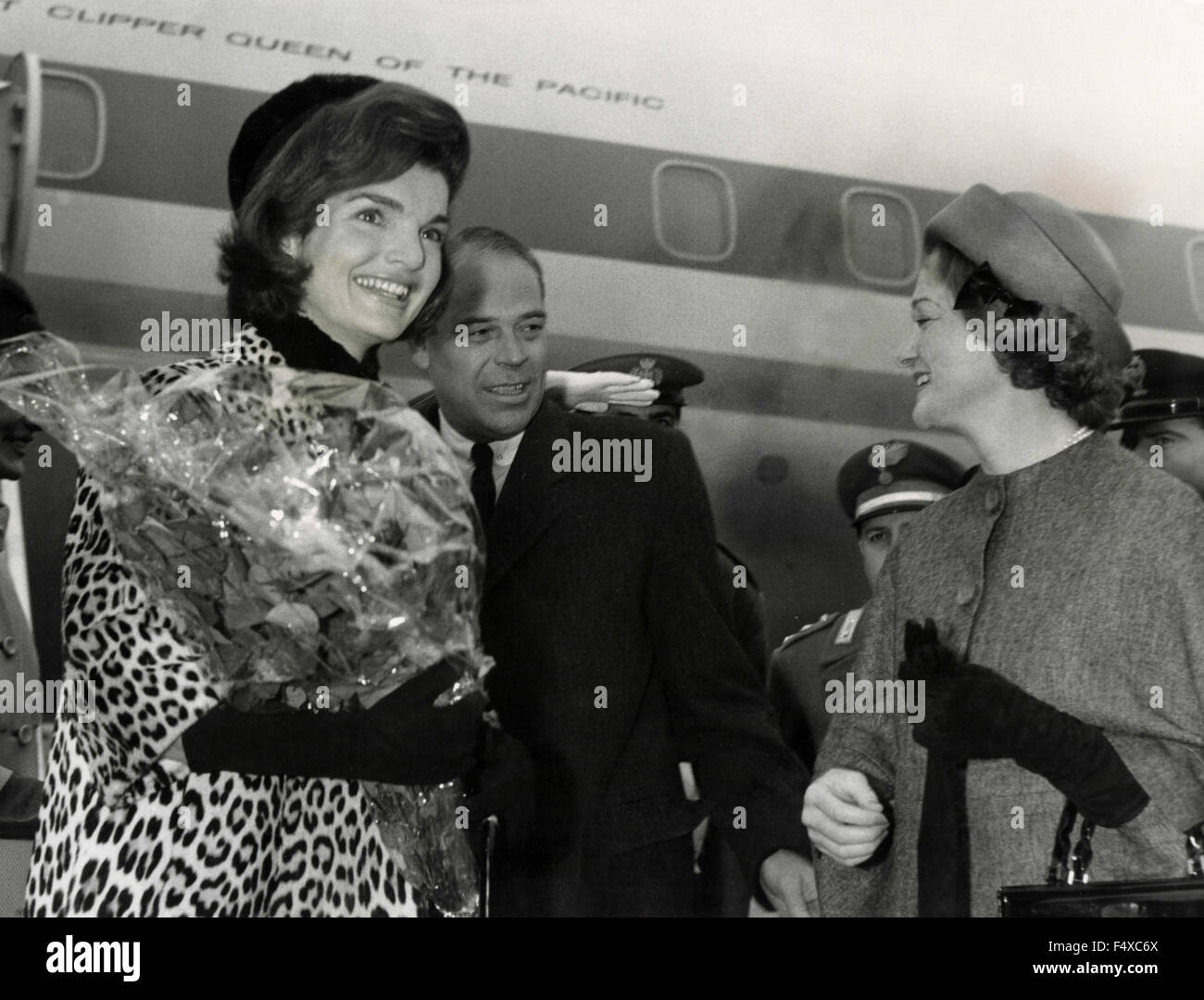 Mrs. Jacqueline Kennedy received at Rome airport by U.S. Ambassador Frederick Reinhardt and his wife, Italy Stock Photo