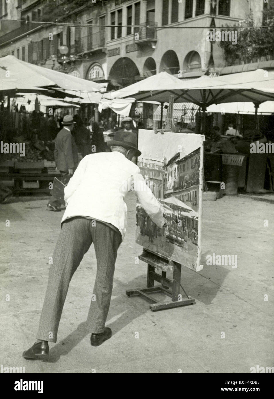 A painter paints in the street, Italy Stock Photo Alamy
