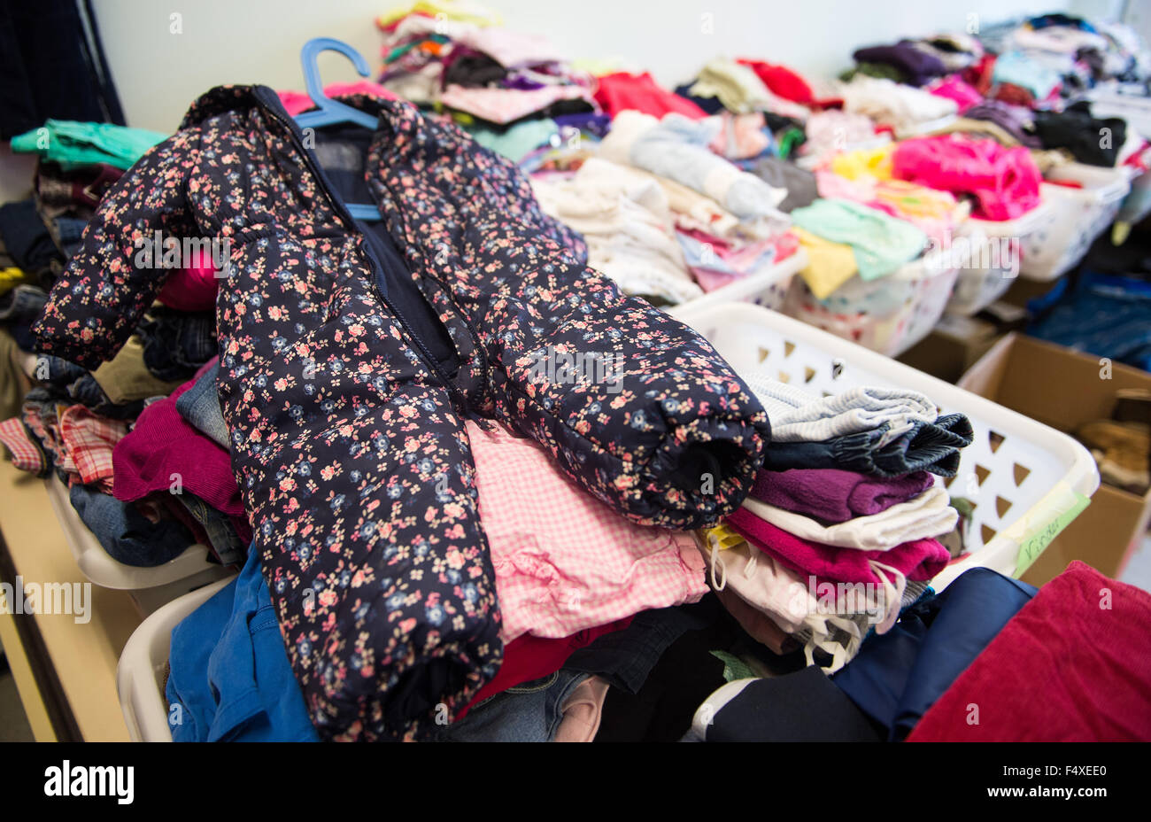 Duesseldorf, Germany. 22nd Oct, 2015. Assorted clothing is seen in the clothing storage room of the refugee shelter in Borbecker Strasse in Duesseldorf, Germany, 22 October 2015. Photo: Monika Skolimowska/dpa/Alamy Live News Stock Photo