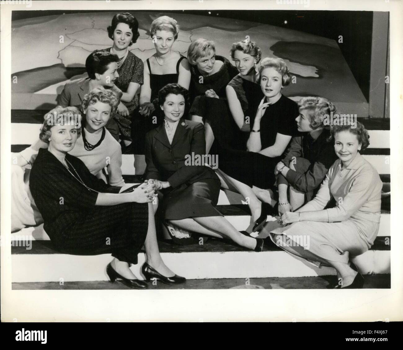 1954 - Europe's Tele-Visions: Girls from ten countries who are seen on the television screens of Europe recently gathered in the British Broadcasting Corporation's studios in London. The gathering was in connection with Eurovision, the network by which European countries exchange or share television programmes. Pictures shows Britain's Sylvia Peters (center) is sorround (clockwise from the left foreground) by ten of her fellow amcees: Janine Lambotte (Belgium: French Service), Paula Semers (Belgium: Flemish Service), Irine Koss (Germany), Marisa Borroni (Italy), Mirelle de Lannoy (Luxembourg), Stock Photo