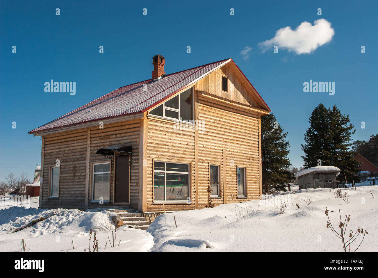 Log house in winter Stock Photo - Alamy