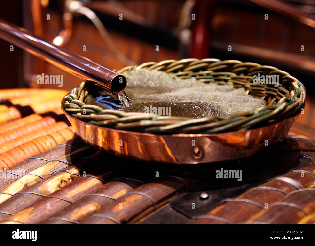 Distilled Hennessy Cognac enters the barrel Stock Photo