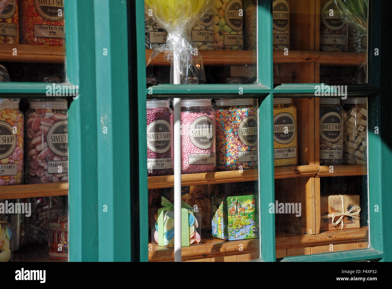 Traditional English Sweet Shop Window display with sweets in glass jars in Bourton-on-the-Water, England Stock Photo
