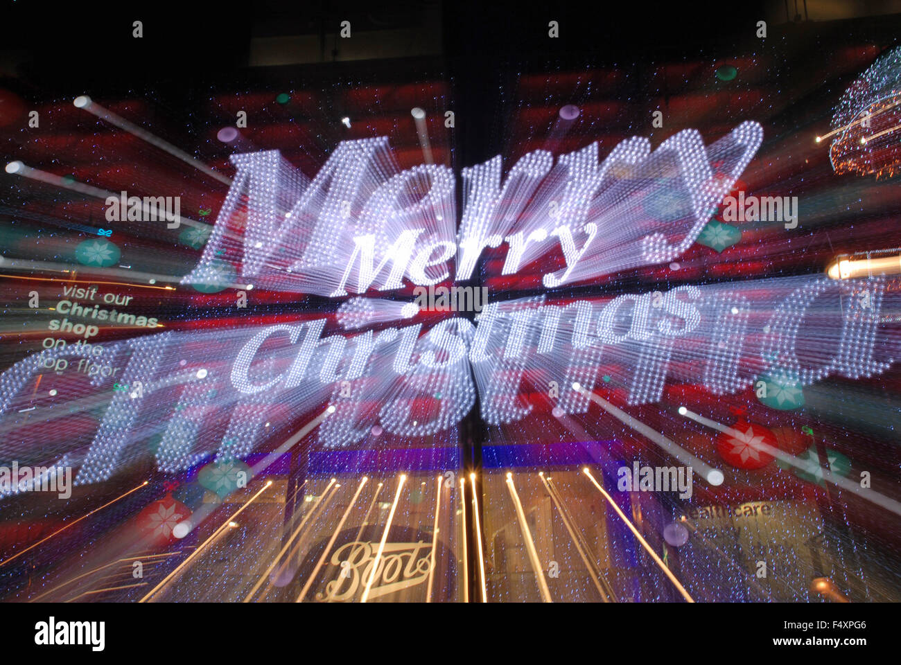 Merry Christmas sign lights in shopping area Oxford Street, London Stock Photo