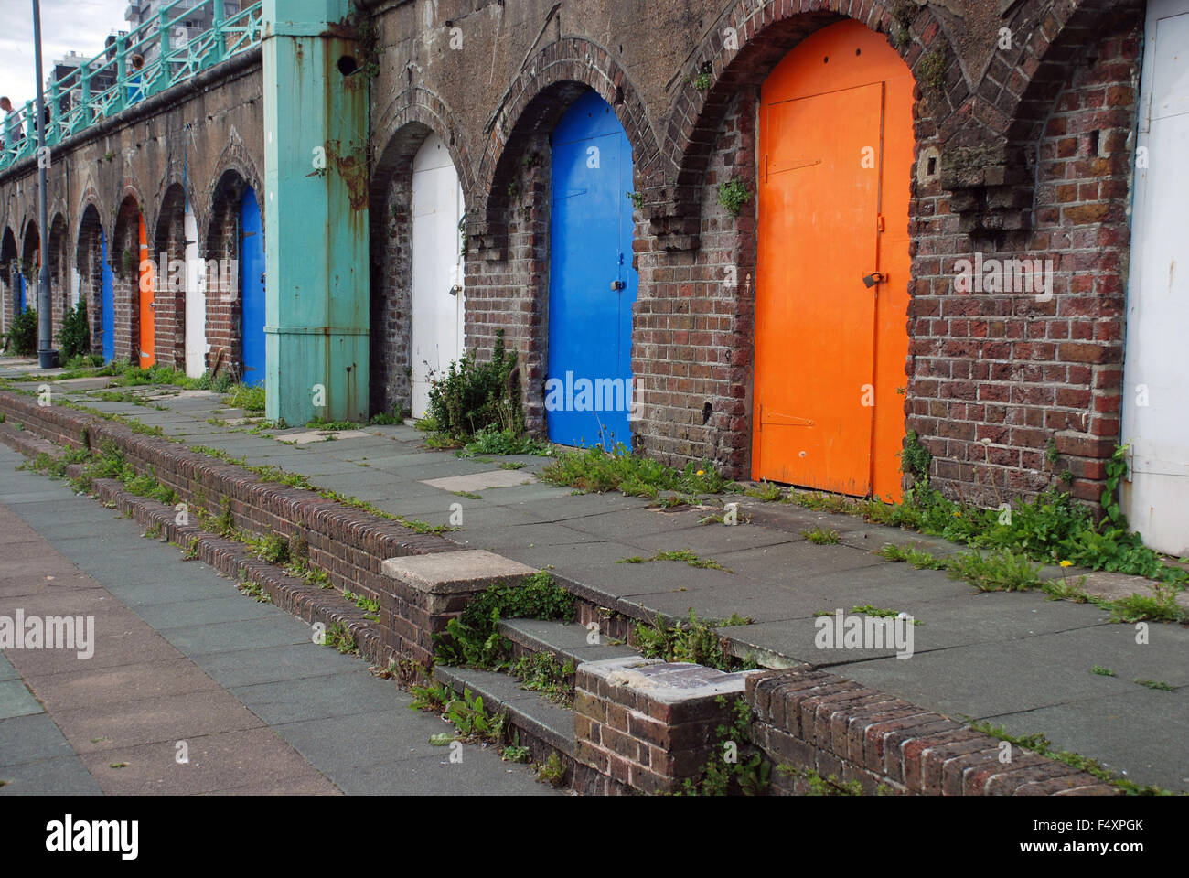 King's Road Arches on Brighton seafront colourful garage doors doorways in Brighton, England Stock Photo