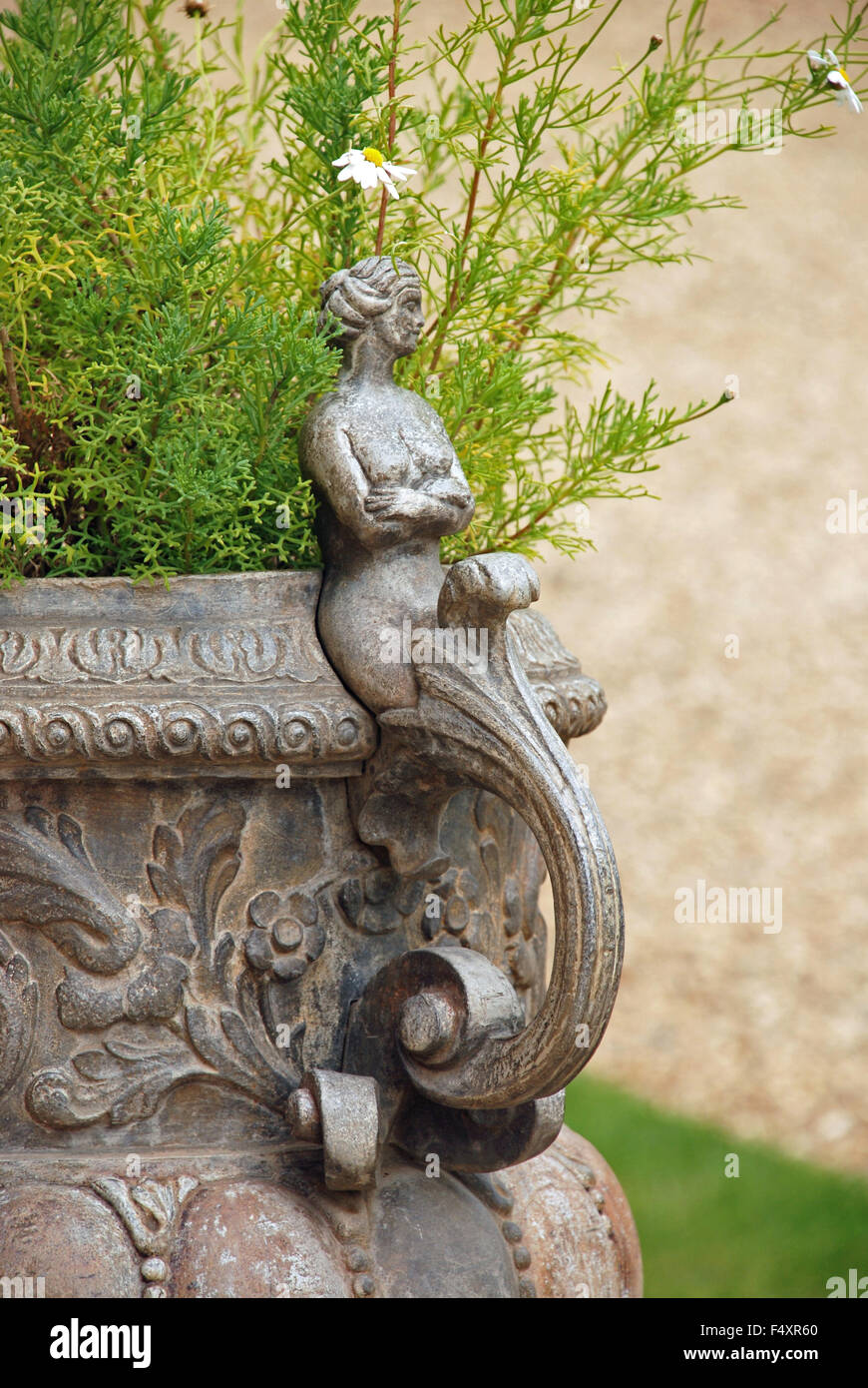 Ornamental flower pot vase garden fairy in Hampton Court Palace Gardens, London England Stock Photo