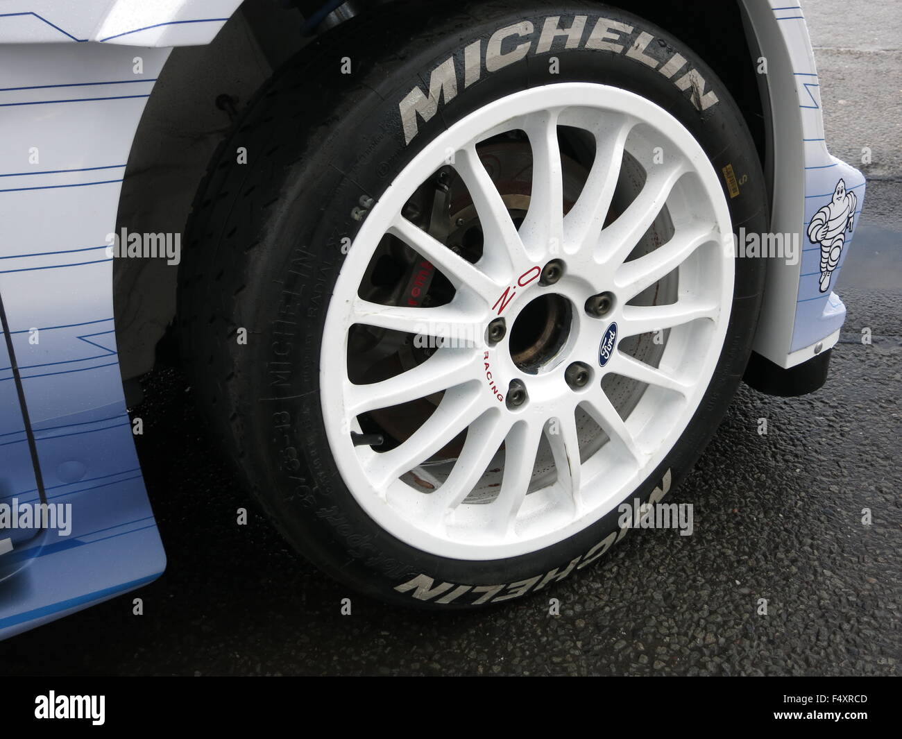 Ford Fiesta RS WRC world rally Car 2015 driven by Elfyn Evans and co-driver  Daniel Barritt shown at donnington park race circuit - showing close up  detail of alloy wheel in white