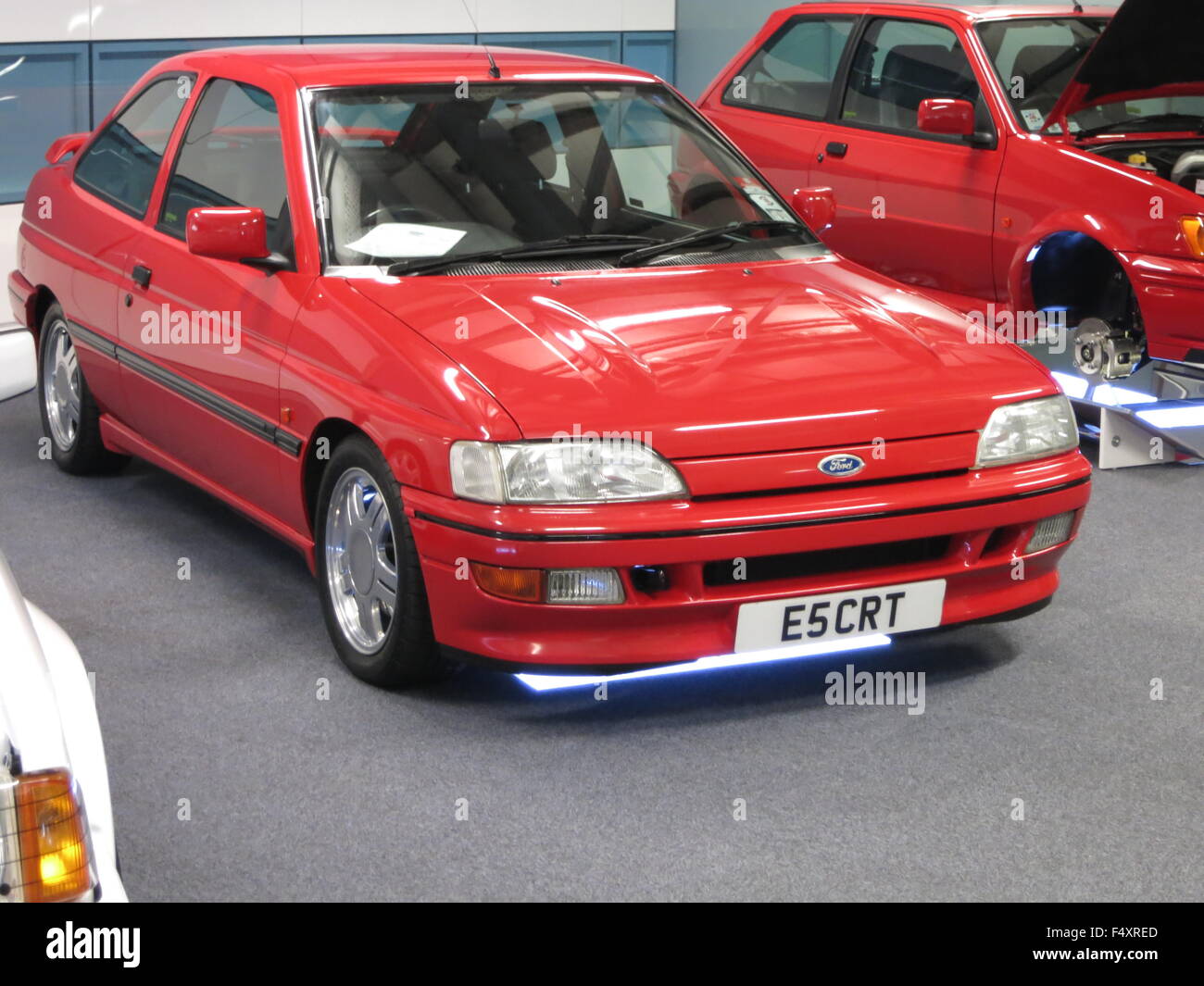 Ford Escort mk5 RS2000 in red - concours orginal factory example at donnington park race track at an RSOC rs owners club car event - showing car front and side with custom number plate Stock Photo