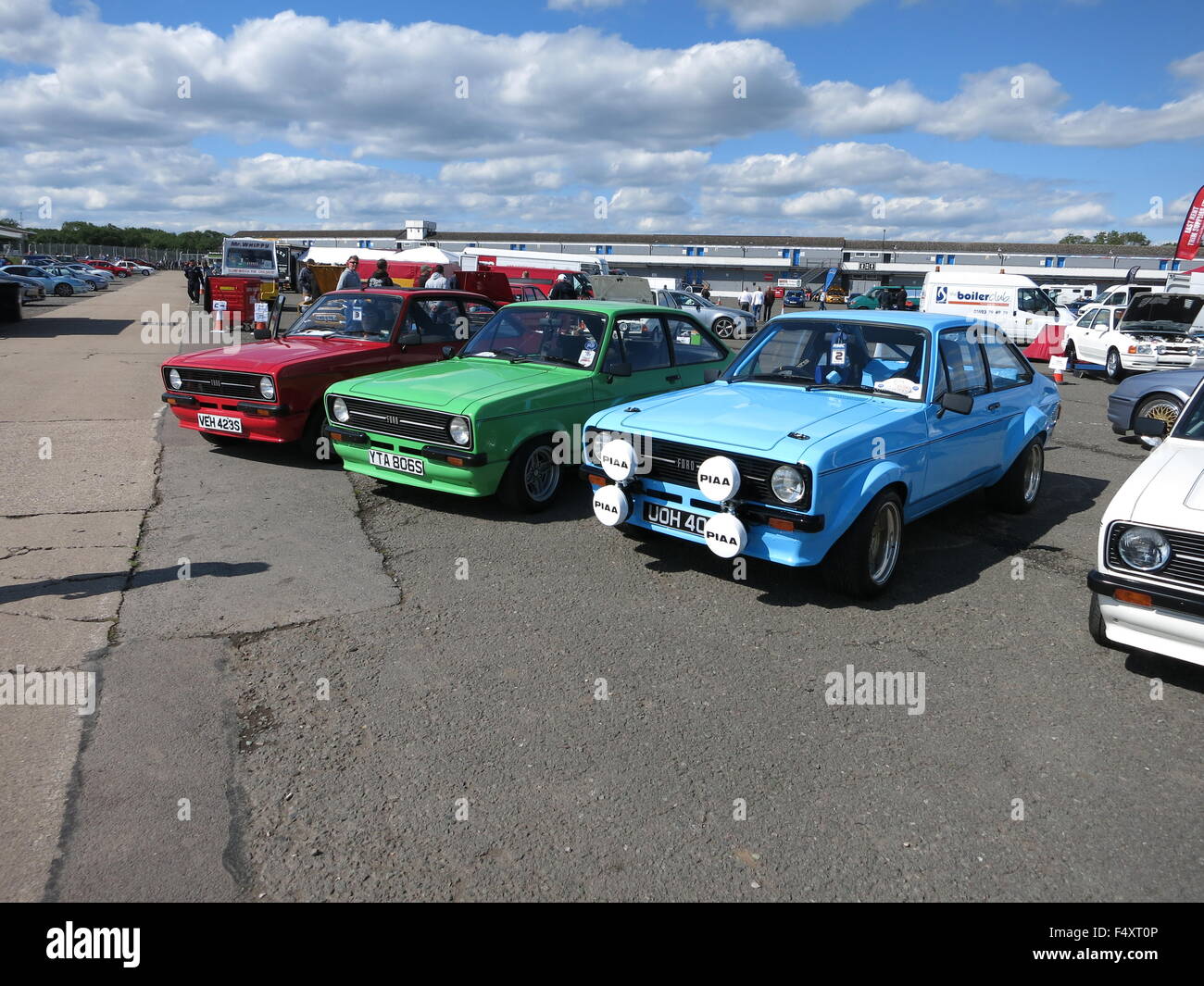 Ford Escort mk2 RS mexico - shown at donnington park race track at RSOC rs owners club event - shows three cars in bright colours Stock Photo