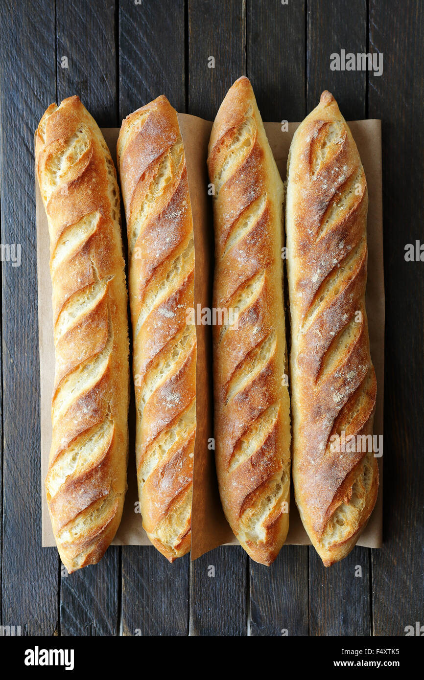 four french baguette on wooden boards Stock Photo