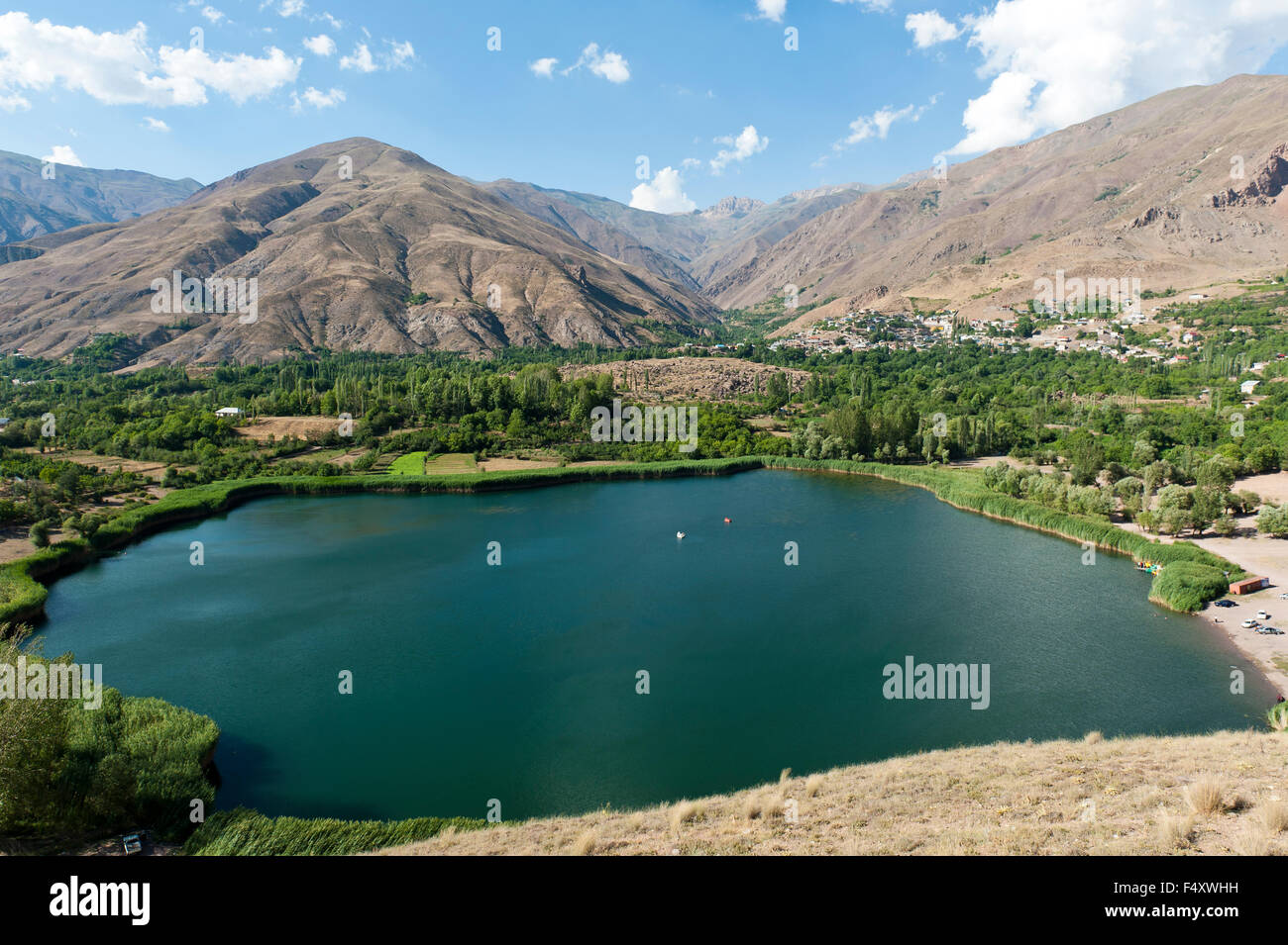 Mountain lake, reeds on shore, Ovan Lake, Moallem Kalayeh, Alamut region, Qazvin province, Alborz, Iran Stock Photo
