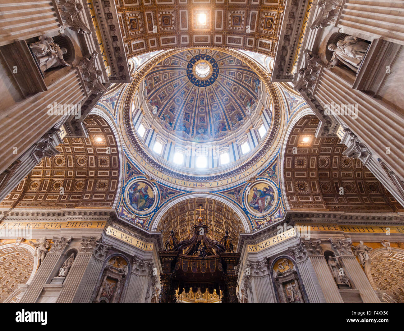 Interior of the Papal Basilica of St. Peter, Vatican: chancel with Bernini's baldacchino altar underneath the main dome. Stock Photo