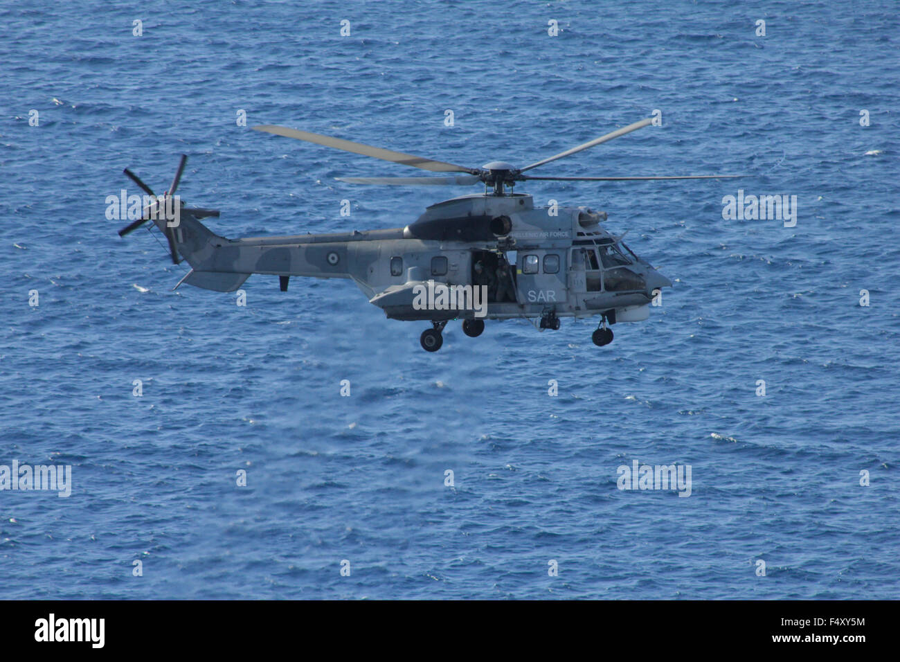 Greek Airforce SAR super puma helicopter, flying over the sea after the end  of the drill. Northern Aegean sea, Lemnos, Greece Stock Photo - Alamy