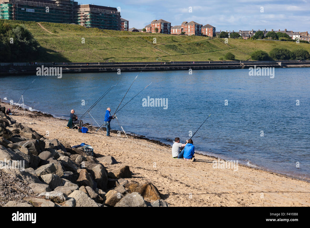 Anglers on the River Tyne beach near the Fish Quay, North Shields, Tyne and Wear, UK Stock Photo