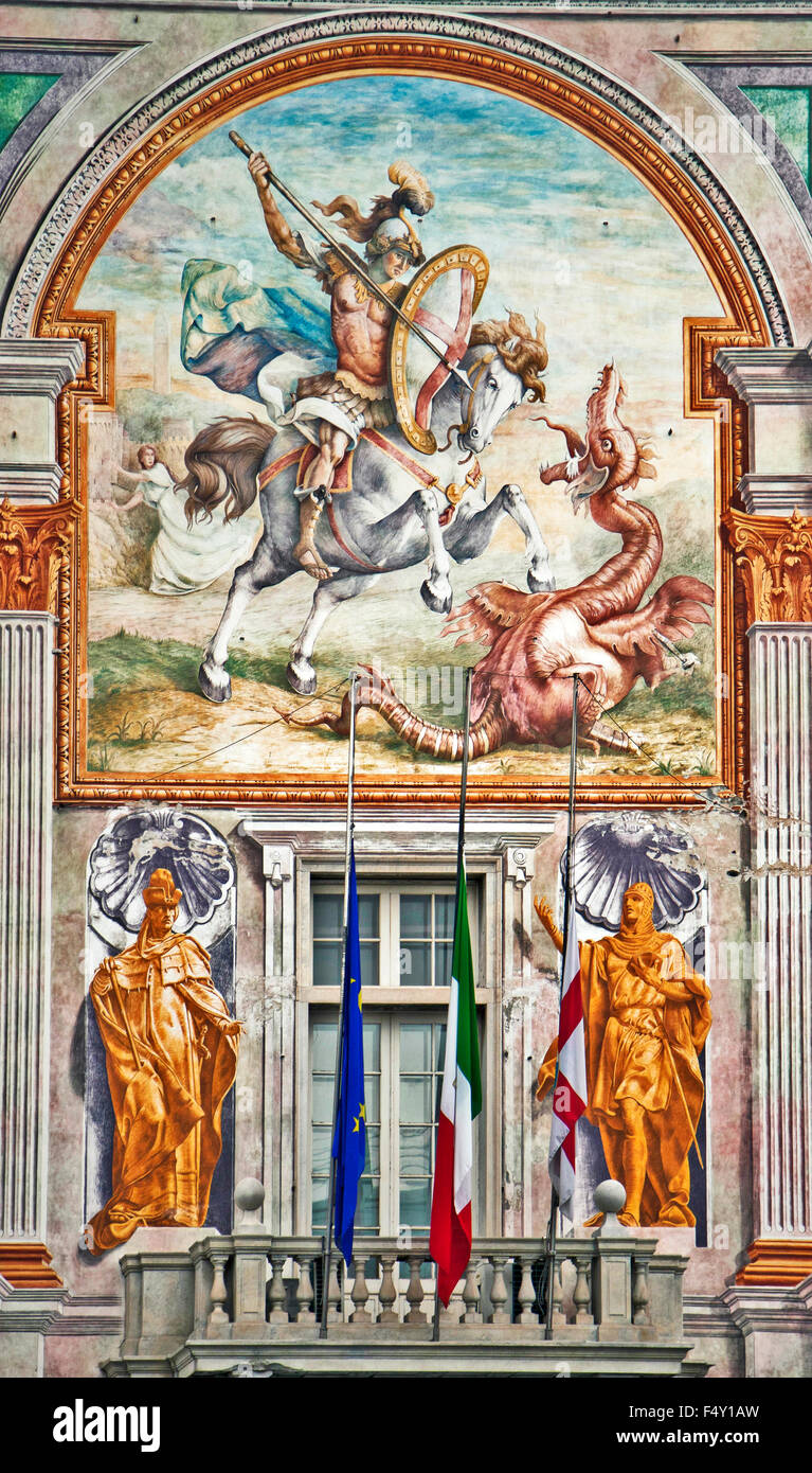 Beautiful example of trompe l'oeil on the facade of St. George Palace in Genoa, St. George on  white horse kills the dragon Stock Photo