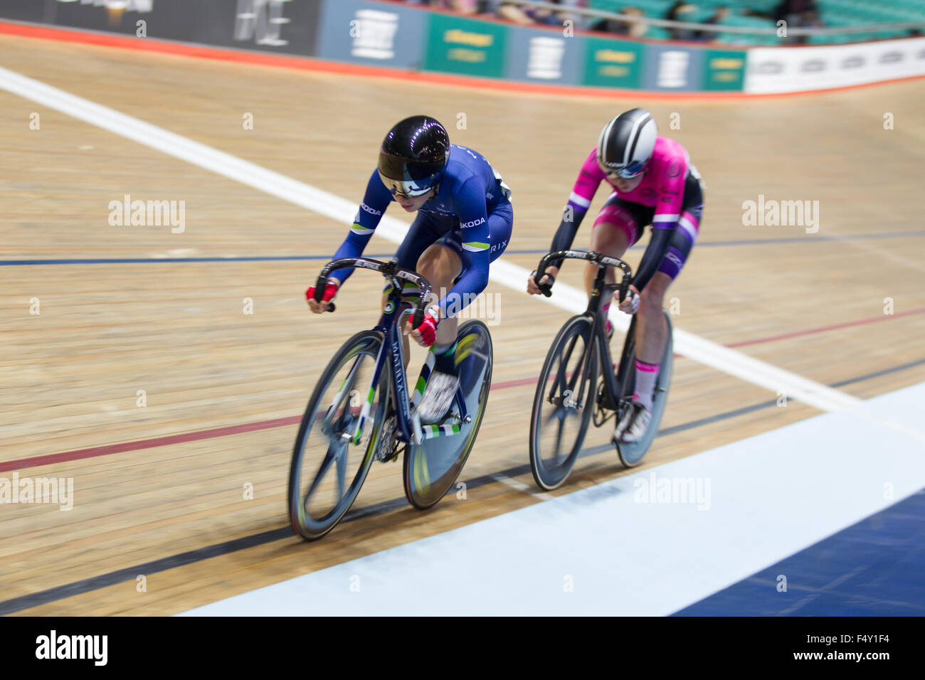 Manchester, UK. 24th Oct, 2015. Champion cyclist Laura Trott (blue) wins again in the Revolution 53 cycling competition at the National Cycling Centre. Second place goes to Katie Archibald (pink). Credit:  Michael Buddle/Alamy Live News Stock Photo